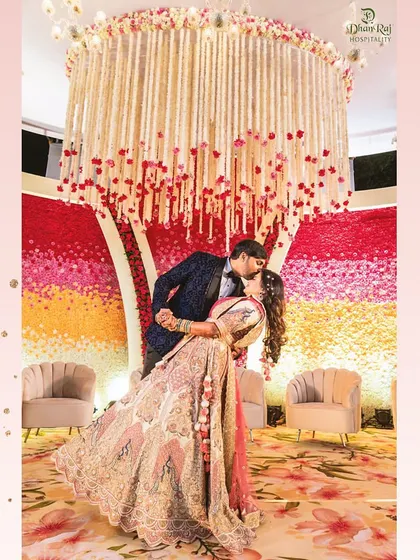 A beautiful moment captured against our custom-designed floral backdrop. We create these picture-perfect settings so you can cherish these memories forever.
