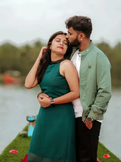 A gentle forehead kiss by the water, this pre-wedding photo is full of tenderness and quiet intimacy.