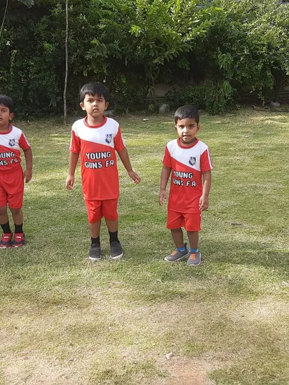 A lineup of our toddler football stars, ready to take on their next fun challenge.