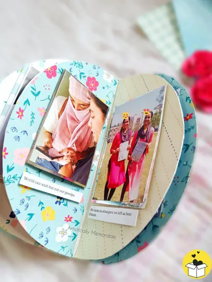 Inside the semicircle album, showing how the curved pages open up to reveal photos and notes about your friendship.