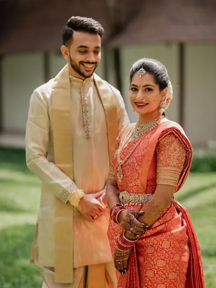 A quiet, intimate portrait framed by lush greenery. We use natural elements to create a sense of romance and tranquility in our couple's wedding photos.