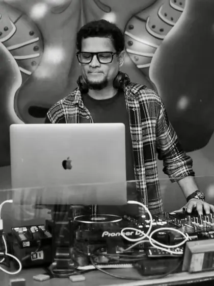 A black and white shot from a club night, focused on the music and the mix.