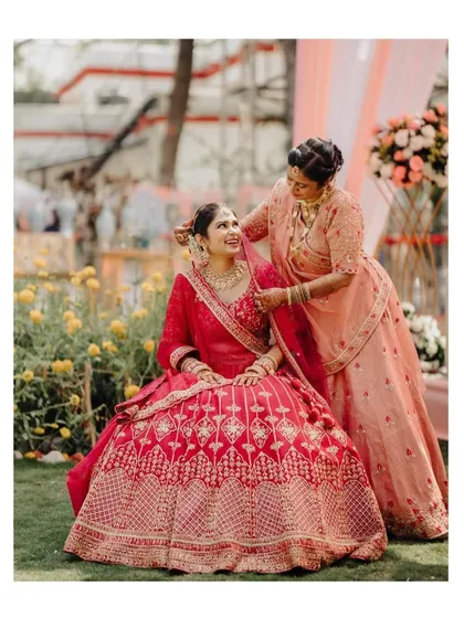 A touching moment between the bride and her mother, sharing a smile and an embrace before the ceremony.