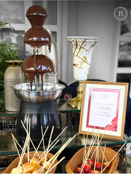 A luxurious chocolate fondue fountain, perfect for a dessert station. We provide a variety of dipping options like fresh strawberries and doughnut bites for an indulgent and interactive experience.