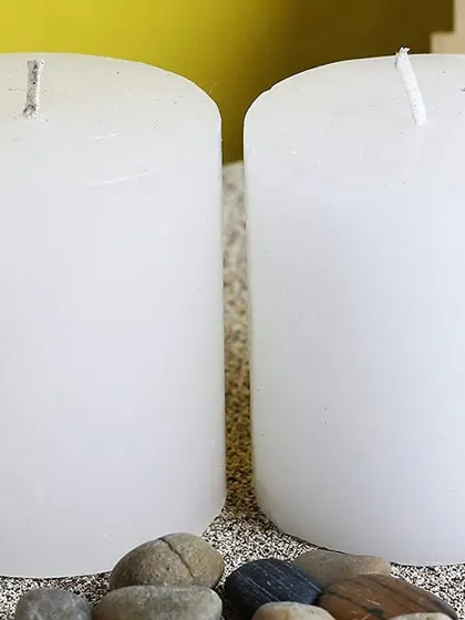 A close-up of two of my white pillar candles. You can see the quality of the wax, which ensures a long and clean burn.