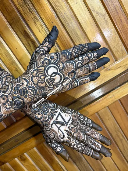 A bold and beautiful engagement design. The initials 'AZ' and a diamond ring symbol are created with negative space, making them the centerpiece of the intricate henna art.