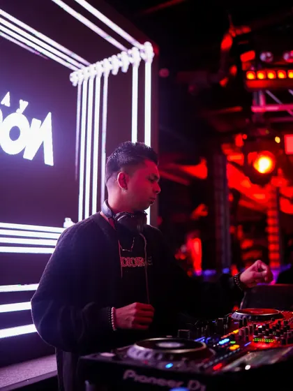 A side profile of me at the Pioneer DJ deck, getting ready to transition to the next song.