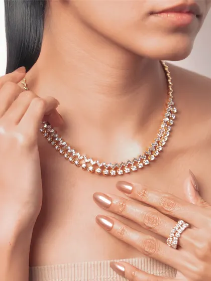 Diamonds should make even ordinary days feel extraordinary. This double-strand diamond necklace and matching ring are crafted to be remembered for a lifetime.