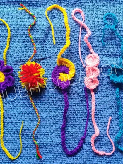 A vibrant and varied collection of five handmade rakhis, each with a unique design and color combination.