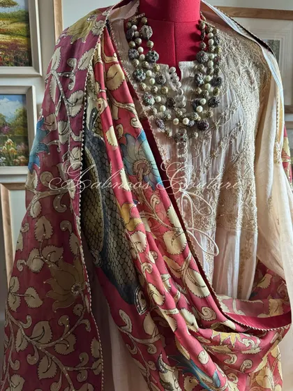 A styled mannequin shot presenting the complete regal look, with the Kalamkari dupatta draped to showcase its grand design.