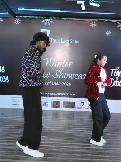 Another action shot from the group dance at our Winter Showcase, capturing the energy of the performance.