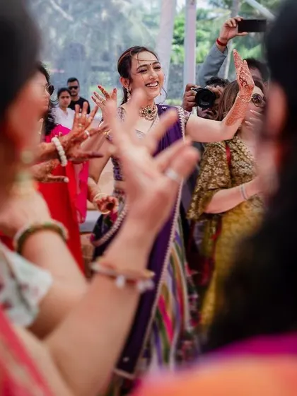 The bride dancing with her family and friends, completely lost in the moment. We capture the energy and joy of the celebration from the heart of the dance floor.
