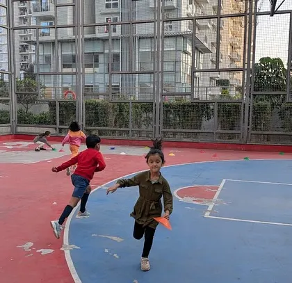 More action from a multi-sport class on an apartment basketball court. We make use of any available space.