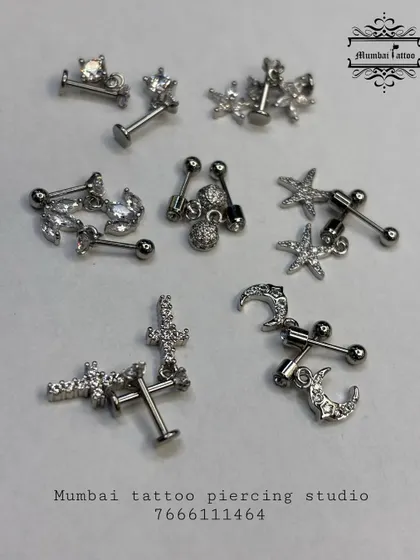A glimpse into our collection of aesthetic ear studs. This assortment includes various designs like stars, crescent moons, and crosses, all featuring crystal accents and crafted for comfort and style.