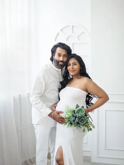 A simple, beautiful portrait with a pop of color from the floral bouquet. This shows how a small prop can add a lovely touch to a minimalist setup.