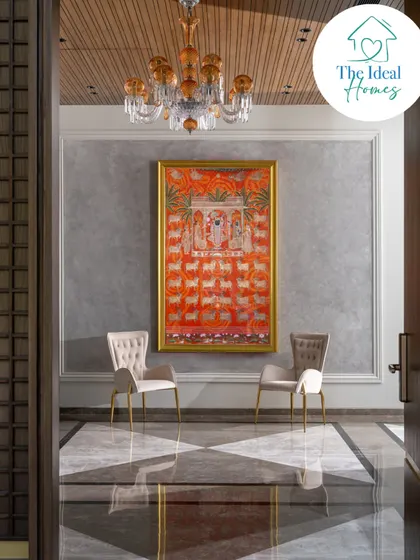 Art is not an afterthought; it is integral to the soul of a home. Here, a traditional Pichwai painting becomes the focal point of the entrance, its vibrant colors enhanced by a crystal chandelier and set against a textured wall. We take pride in weaving our clients' stories and heritage into the very fabric of their homes.