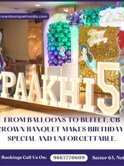 A mermaid-themed fifth birthday decoration. The large light-up name and number, paired with an "under the sea" balloon arch, bring the magical theme to life.