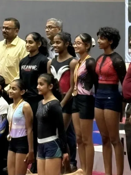 A proud moment as our gymnasts from two different states, all training under our roof, stand together before competing at the Women's Artistic Gymnastics Nationals. This shows our reputation as a center of excellence.