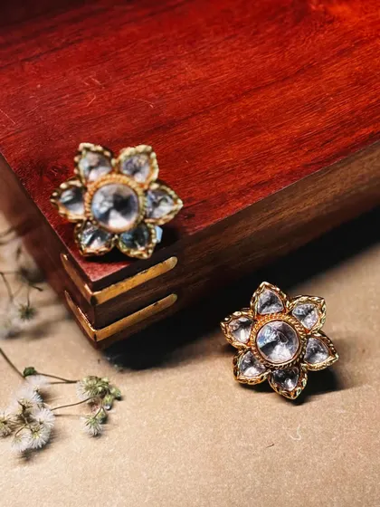 Simple yet stunning, these floral-shaped polki studs are a versatile addition to any jewelry collection.