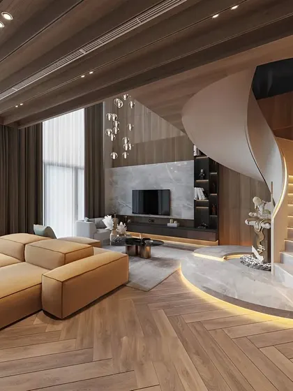 Another view of the duplex living room with the sculptural spiral staircase. This angle shows the herringbone wood flooring and the comfortable, modern sofa, perfect for a large family.