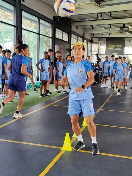 Here, members of the Indian national women's team engage in priming drills. We use exercises like reactive ball drops and partner challenges to enhance focus and prepare athletes for high-intensity training.