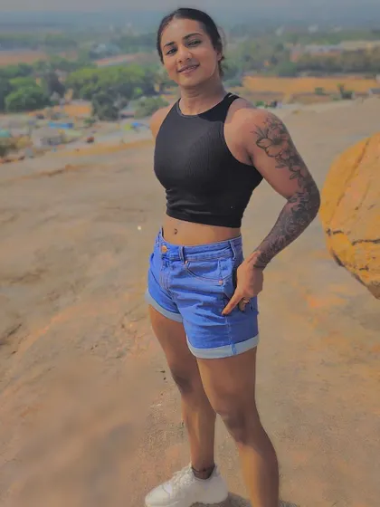 Don't just show up, make a statement. A candid shot of me on the rocks, but my mind is always on the next gym session.
