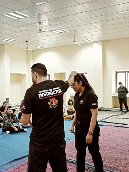 I demonstrate a pressure point technique to control an opponent. Understanding human anatomy is a key part of my teaching, allowing a smaller person to control a larger one.