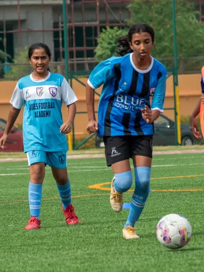 Three of our sub-junior players on the move during a match, showcasing the teamwork and coordination we develop from a young age.