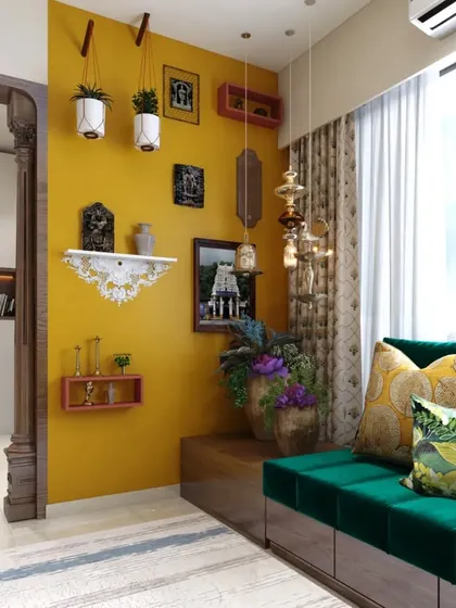A vibrant living area where a bold yellow accent wall is paired with a rich green velvet sofa. This space beautifully blends modern design with traditional Indian decor elements.