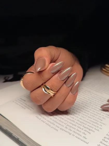 A close-up of our mocha mousse shade. This image shows the beautiful, coffee-inspired neutral color on perfectly shaped almond nails.