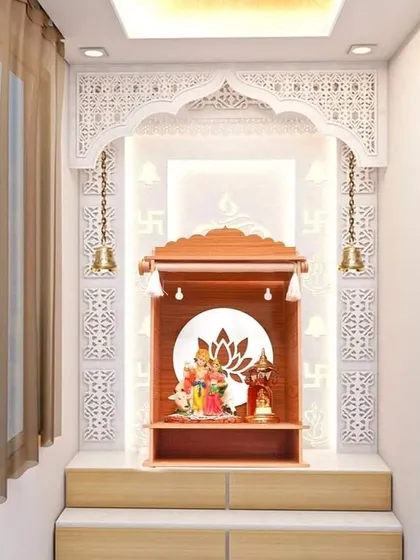 The same wall-niche pooja mandir design, showcasing the detailed craftsmanship and the serene atmosphere created by the soft backlighting.