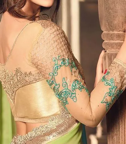 Sheer sleeves with delicate embroidery offer an elegant and graceful look. I can add this feature to any blouse design, matching the embroidery to your saree.
