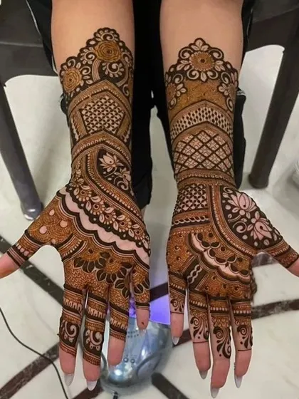 A classic bridal design with a focus on traditional patterns. This style uses paisleys, floral motifs, and checkerboard fills to create a timeless and elegant look.