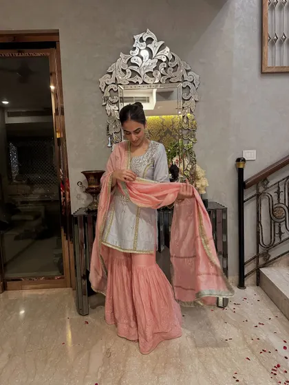A beautiful powder blue and pink sharara set I designed. The delicate embroidery and soft colors make it a great choice for a daytime wedding event.