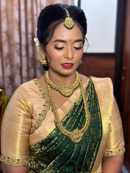 An elegant engagement look for my client. The focus is on golden shimmery eyes and a classic red lip, paired with traditional temple jewelry.