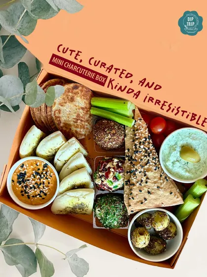 This is my Mini Charcuterie Box, a curated selection of our finest dips, breads, and artisanal bites. It’s the perfect gourmet gift or an irresistible treat for a party of one.