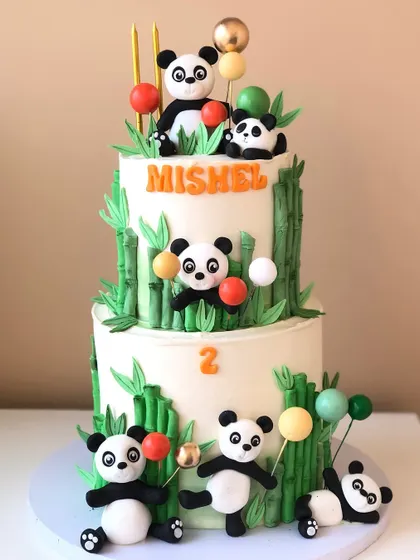 A playful two-tiered panda cake, with cute pandas climbing bamboo stalks and playing with balloons. This is one of my cutest designs!