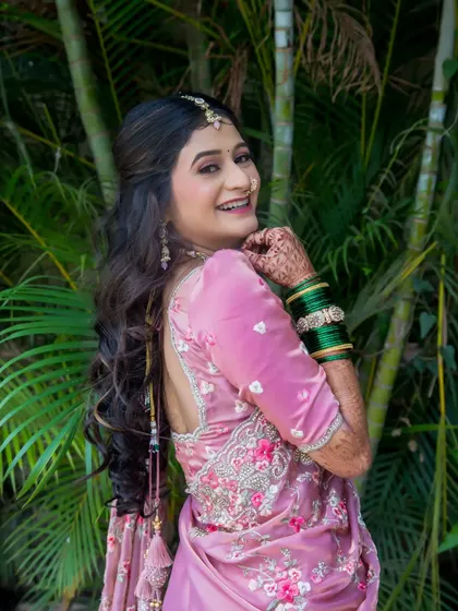 A joyful, over-the-shoulder smile from the bride, her happiness is absolutely contagious in this candid portrait.