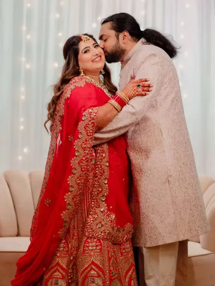 A tender moment captured perfectly. The bride's soft waves and glowing makeup create a romantic and timeless feel.