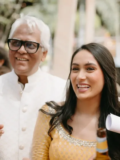 A father and daughter sharing a happy moment during the Haldi festivities. Capturing these priceless interactions is a key part of the wedding story I help create.