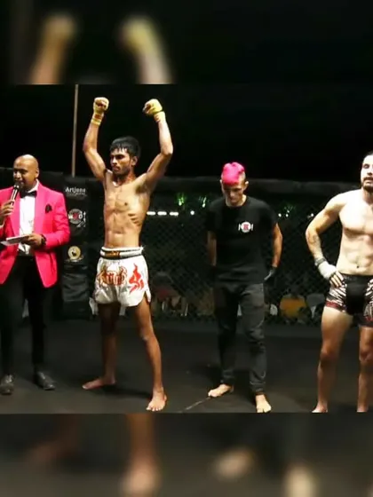 The victory pose. Our fighter celebrating his win at Art of Combat in Goa, a testament to his hard work and our team's support.