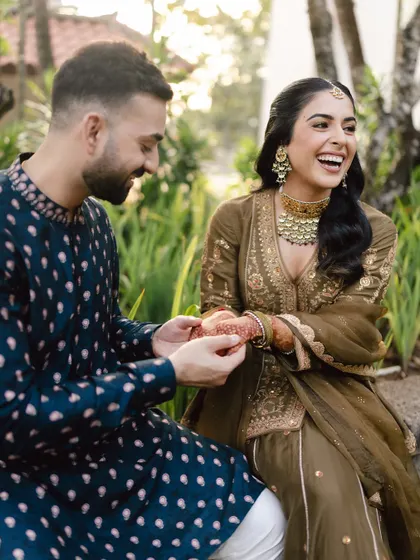 A candid moment of laughter between a couple in Bali. These unposed shots are essential for capturing the true spirit of the wedding day.