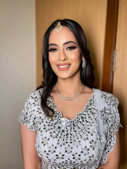 A full view of this elegant sangeet look. The makeup is timeless and sophisticated, perfect for any evening celebration.