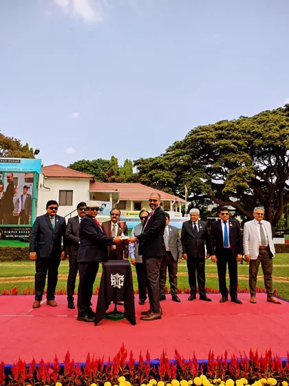 The Champion Trainer Trophy is presented to the winning connections of Armstrong.