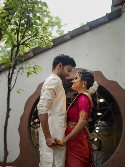 A simple, honest portrait in a quiet courtyard. The way they look at each other, holding hands, speaks volumes about their connection, which is what I always aim to capture.