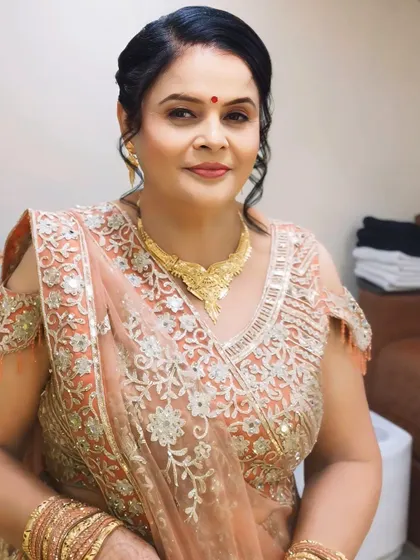 A beautiful portrait of the client, highlighting her graceful smile and the subtle, age-appropriate makeup.