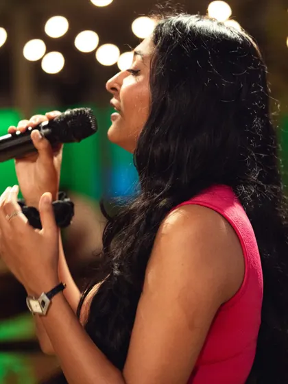 Lost in the music during a live set. This profile shot captures the focus and emotion I put into every performance, ensuring a professional and heartfelt delivery of each song.