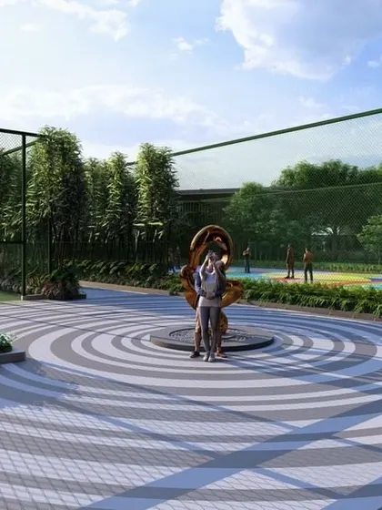 A central plaza at 'Villa On Sky' featuring a modern sculpture, serving as a focal point and meeting place adjacent to the sports courts.