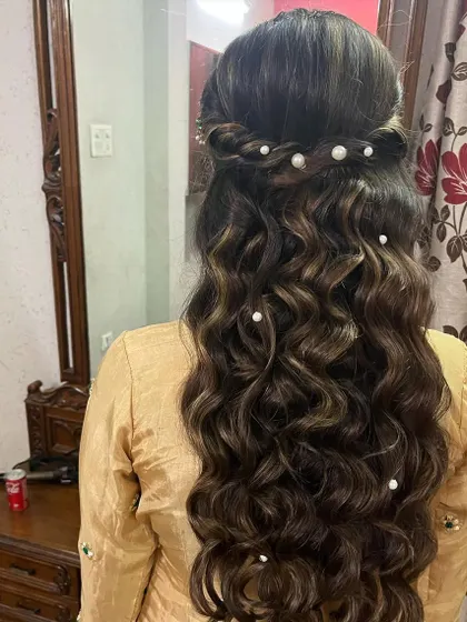 We added delicate pearl pins to these deep waves for a touch of elegance. This is a beautiful way to accessorize an open hairstyle for a formal event.