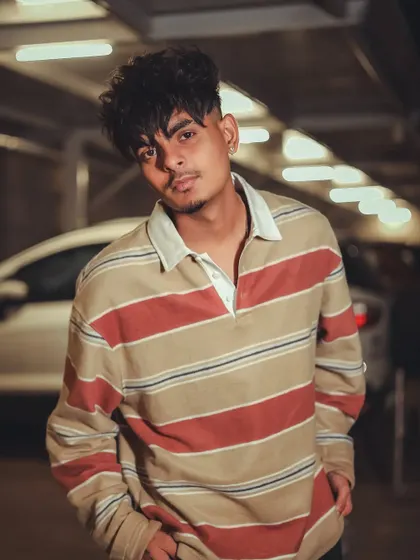 A casual men's portrait in an underground parking lot, using the location to create a moody, urban vibe.